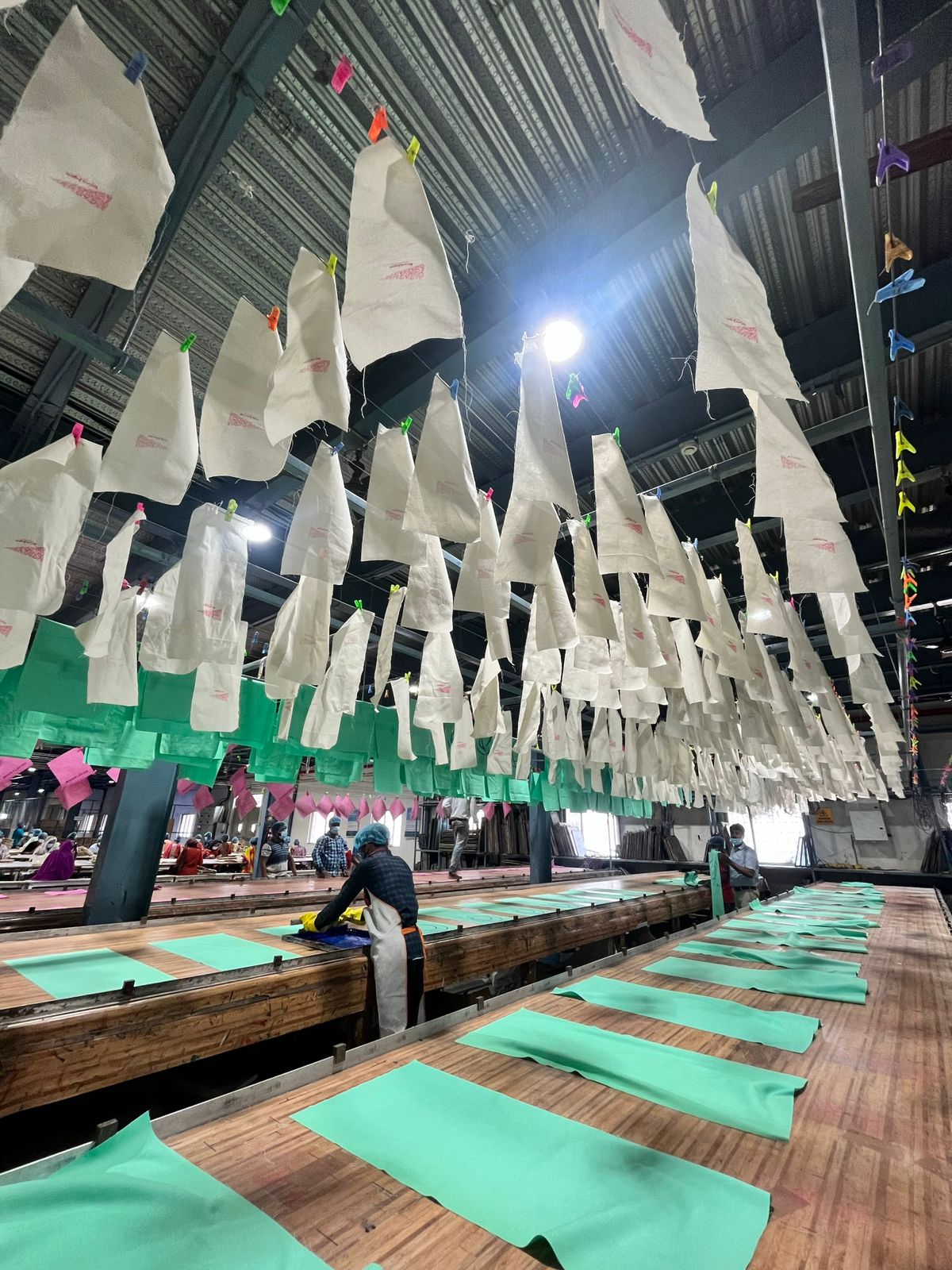 Workers on the fabric processing floor